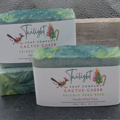 Two bars of soap from Twilight Soap Company on a wooden surface
