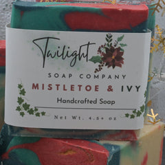 Colorful soap bar with a label from Twilight Soap Company, featuring 'Mistletoe & Ivy' design.