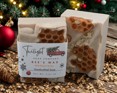 Beeswax soap with honeycomb design and a Twilight Soap Company label on a gray surface.