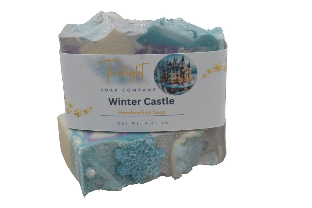 Bar of soap with a label for 'Twilight Soap Company Winter Castle' on a wooden surface.