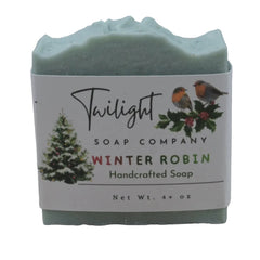 Handcrafted soap bar with 'Twilight Soap Company' label featuring winter robin design on a wooden background.