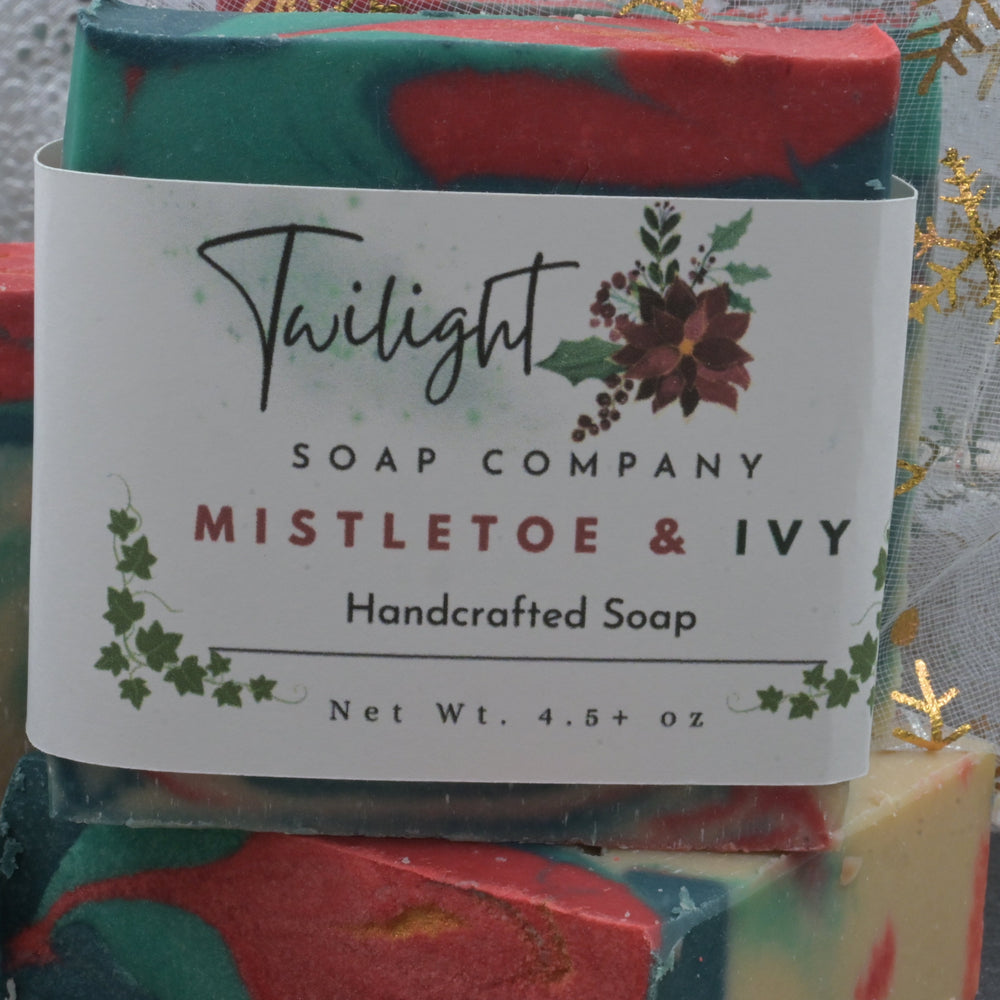 Colorful soap bar with a label from Twilight Soap Company, featuring 'Mistletoe & Ivy' design.