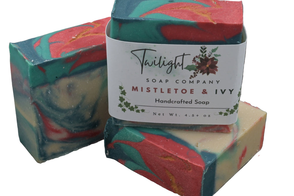 Handcrafted soap with a label from Twilight Soap Company on a dark surface