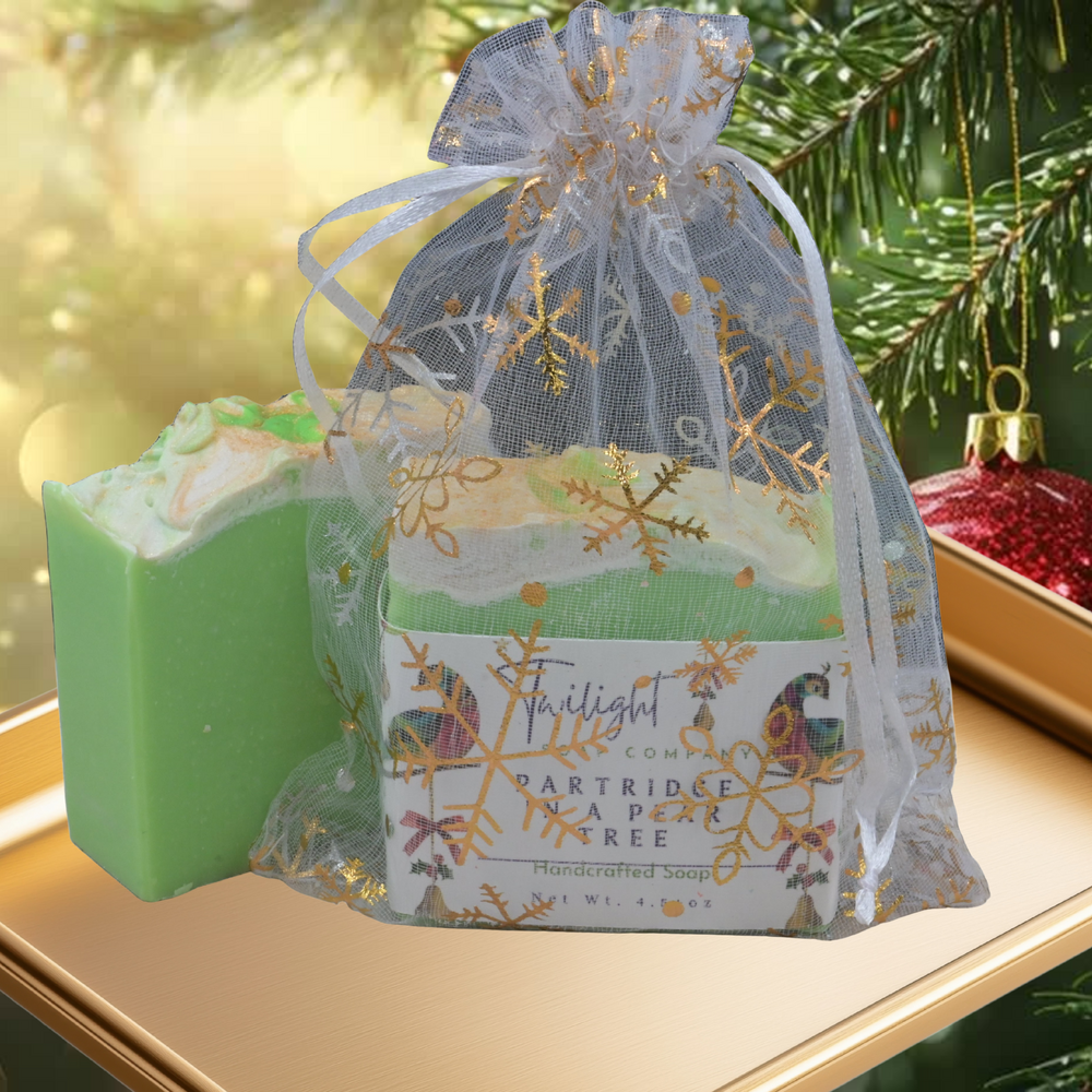 Green soap bar next to a decorative gift bag on a wooden surface with a dark background