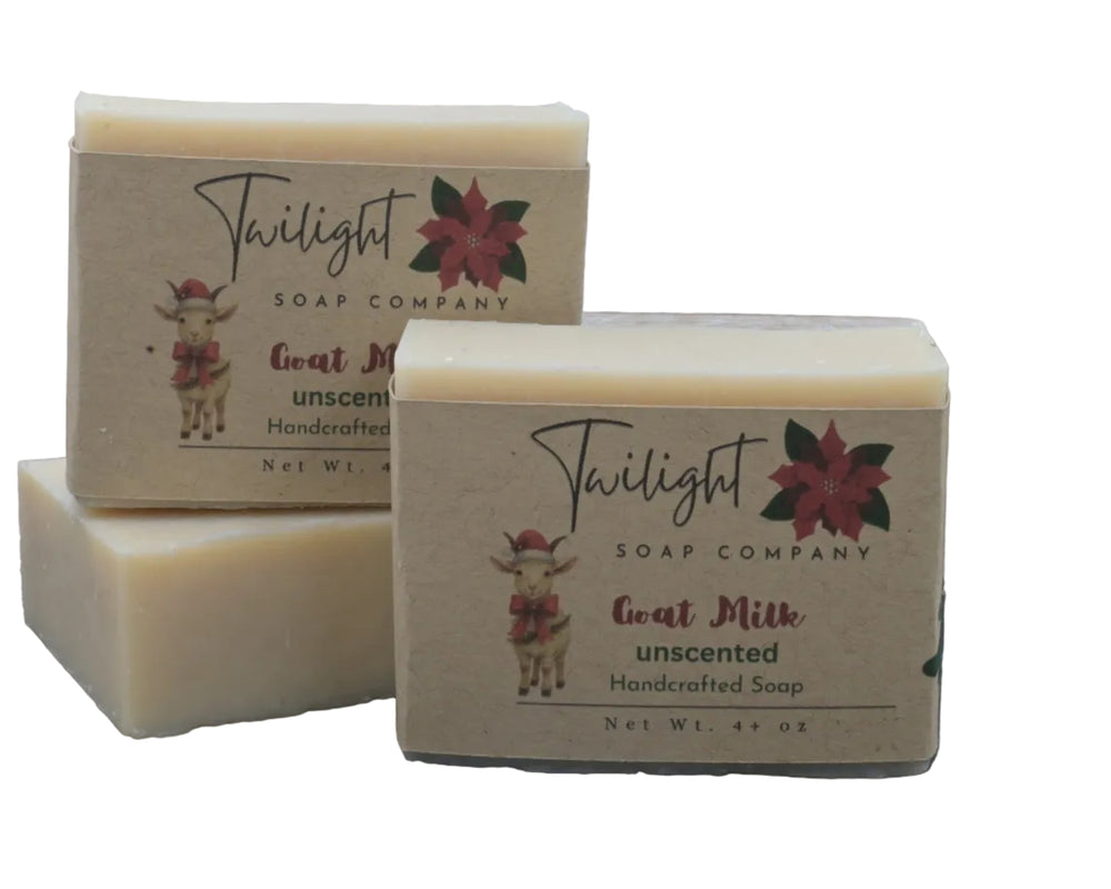 Two bars of Twilight Soap Company goat milk soap on a textured surface with a white background.