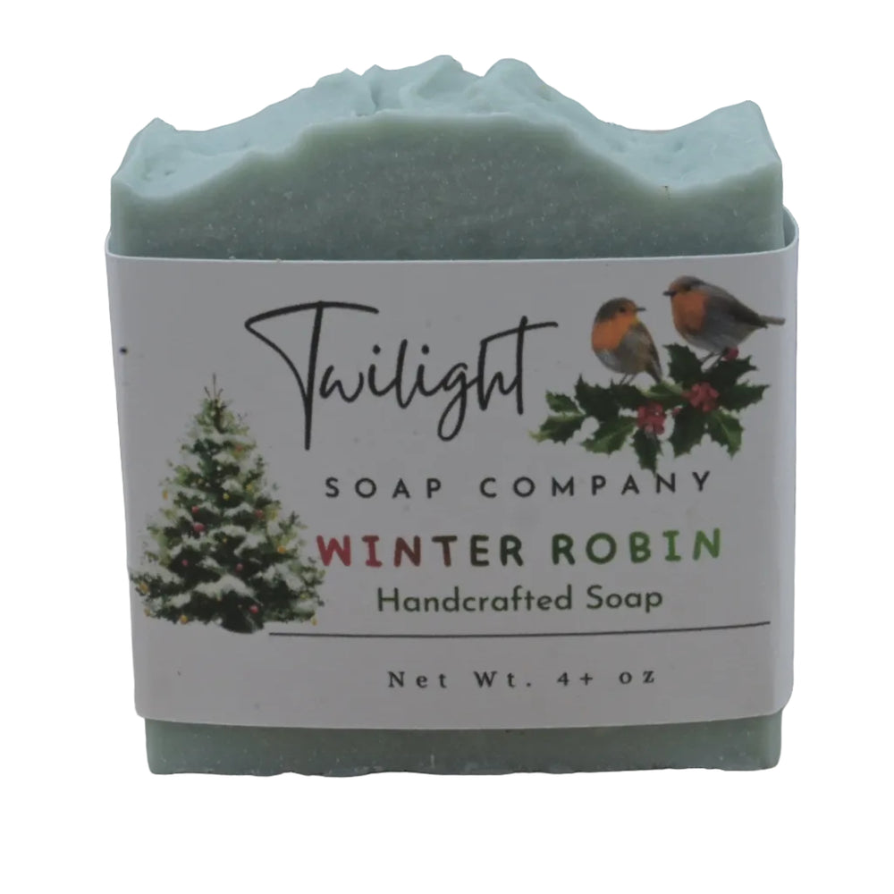 Handcrafted soap bar with 'Twilight Soap Company' label featuring winter robin design on a wooden background.