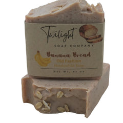 Bar of soap from Twilight Soap Company with banana bread flavor on a wooden background